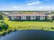 Condo building with water views, showing individual unit and surrounding landscape at 175 Kings Hwy # B6-526, Punta Gorda, FL 33983