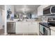 Open concept kitchen with stainless steel appliances and a breakfast bar at 175 Kings Hwy # B6-526, Punta Gorda, FL 33983