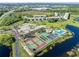 Well-maintained tennis courts situated near the community pool and lake at 175 Kings Hwy # B6-526, Punta Gorda, FL 33983