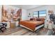Spacious bedroom with large window, wood-look flooring, and a king-size bed at 175 Kings Hwy # B6-526, Punta Gorda, FL 33983