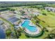 Relaxing pool and tennis courts surrounded by lush greenery at 175 Kings Hwy # B6-526, Punta Gorda, FL 33983