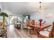 Bright dining room with a wood table and chairs, open to living area at 175 Kings Hwy # B6-526, Punta Gorda, FL 33983