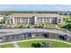 Aerial view of a two-story building with surrounding parking at 175 Kings Hwy # B6-526, Punta Gorda, FL 33983