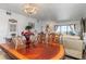 Formal dining room with a rich wood table and living room view at 175 Kings Hwy # B6-526, Punta Gorda, FL 33983
