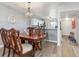 Dining area with a dark wood table and chairs near the kitchen at 175 Kings Hwy # B6-526, Punta Gorda, FL 33983