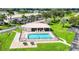 Community pool and surrounding landscaping viewed from above at 26485 Rampart Blvd # C1, Punta Gorda, FL 33983