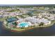 Resort-style community pool, tennis courts, and clubhouse at 1676 Palace Ct, Punta Gorda, FL 33980