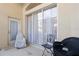 Private patio with seating area and sliding doors at 1676 Palace Ct, Punta Gorda, FL 33980