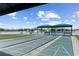Enjoyable shuffleboard courts with covered seating areas at 1676 Palace Ct, Punta Gorda, FL 33980