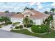Single-story house with a two-car garage and landscaped yard at 1676 Palace Ct, Punta Gorda, FL 33980
