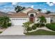 One-story home with a two-car garage and landscaped yard at 1676 Palace Ct, Punta Gorda, FL 33980