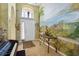 Bright entryway with a scenic mural and decorative accents at 1676 Palace Ct, Punta Gorda, FL 33980