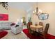 Bright dining area with a round table and four chairs, perfect for Gathering meals at 1676 Palace Ct, Punta Gorda, FL 33980