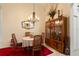 Cozy dining area showcasing a round table, four chairs, and a display cabinet at 1676 Palace Ct, Punta Gorda, FL 33980