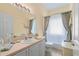 Bathroom with a single vanity and bathtub at 1676 Palace Ct, Punta Gorda, FL 33980