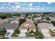 Aerial view of a residential neighborhood with houses and lush greenery at 1676 Palace Ct, Punta Gorda, FL 33980