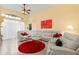Spacious living area with large sectional sofa and red rug at 1676 Palace Ct, Punta Gorda, FL 33980