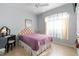 Cozy bedroom with a full-size bed and window at 1676 Palace Ct, Punta Gorda, FL 33980