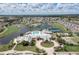 Community center with pool, tennis courts, and lush landscaping at 1676 Palace Ct, Punta Gorda, FL 33980