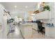 Well-equipped kitchen with island, ample counter space, and white cabinets at 1676 Palace Ct, Punta Gorda, FL 33980