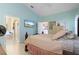 Bright bedroom with a king-size bed and access to a bathroom at 1676 Palace Ct, Punta Gorda, FL 33980