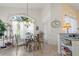 Charming breakfast nook with a round glass table and ornate chairs at 1676 Palace Ct, Punta Gorda, FL 33980