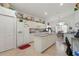 Bright kitchen boasting an island, granite countertops, and white cabinetry at 1676 Palace Ct, Punta Gorda, FL 33980