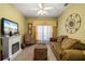 Cozy living room featuring a fireplace and comfortable seating at 1676 Palace Ct, Punta Gorda, FL 33980