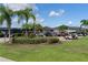 Community golf cart parking area with lush landscaping at 1676 Palace Ct, Punta Gorda, FL 33980