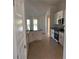 Bright kitchen with granite countertops, stainless steel appliances, and white cabinetry at 14326 Edsel Dr, Port Charlotte, FL 33981