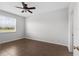 Bright bedroom with tile flooring and large windows providing ample light at 18457 New London Ave, Land O Lakes, FL 34638