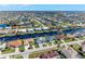 Aerial view of the property in a waterfront community with canals and numerous homes at 630 Coronado Dr, Punta Gorda, FL 33950