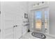 Bright foyer with decorative front door, adjacent closet, and neutral flooring at 630 Coronado Dr, Punta Gorda, FL 33950