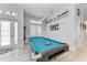Inviting game room features a pool table, natural light, and a view of the entryway at 630 Coronado Dr, Punta Gorda, FL 33950