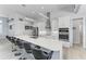 Bright kitchen features a large island with bar seating, stainless steel appliances, and modern white cabinets at 630 Coronado Dr, Punta Gorda, FL 33950