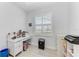 An office space featuring a desk, a window with blinds, and lots of sunlight at 630 Coronado Dr, Punta Gorda, FL 33950