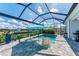 Relaxing screened-in pool with lounge chairs and beautiful water views at 630 Coronado Dr, Punta Gorda, FL 33950