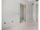 Unfinished room, ready for customization, with new drywall and flooring at 2502 Pinewood St, North Port, FL 34288