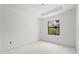 Unfinished bedroom with large window and drywall at 2502 Pinewood St, North Port, FL 34288