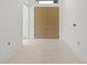 Bright entryway with double doors leading into the home at 2502 Pinewood St, North Port, FL 34288