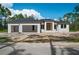 New construction home with a modern design and attached garage at 2502 Pinewood St, North Port, FL 34288