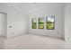 Well-lit bedroom with three windows offering natural light at 2502 Pinewood St, North Port, FL 34288