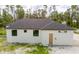 Aerial view of the home's side, highlighting its features at 2502 Pinewood St, North Port, FL 34288