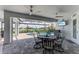 Covered patio with outdoor dining set and pool access at 630 Coronado Dr, Punta Gorda, FL 33950
