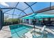 Enjoy this refreshing screened pool with lounge chairs at 630 Coronado Dr, Punta Gorda, FL 33950