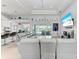 Spacious living area featuring sliding doors to backyard and a large TV at 630 Coronado Dr, Punta Gorda, FL 33950