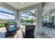 Relaxing pool area with screened enclosure and patio furniture at 630 Coronado Dr, Punta Gorda, FL 33950