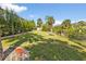 Landscaped backyard with a grassy area and privacy at 2208 Barksdale St, Port Charlotte, FL 33948