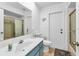 Updated bathroom with a single sink vanity, toilet, and shower at 2208 Barksdale St, Port Charlotte, FL 33948