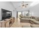 Living Room with large TV, sectional sofa and view into kitchen at 2208 Barksdale St, Port Charlotte, FL 33948